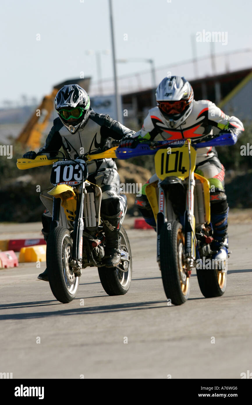 motocross riders battle it out in front during bike race at the ...
