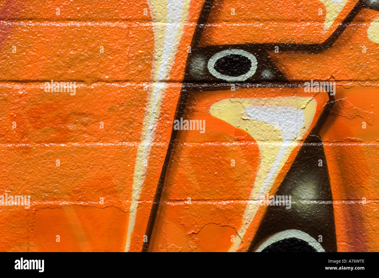 Wall painting orange black brown graffiti street art Stock Photo