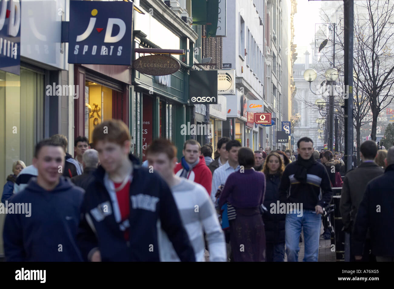 crowd of people in front of shops out christmas shopping in Belfast
