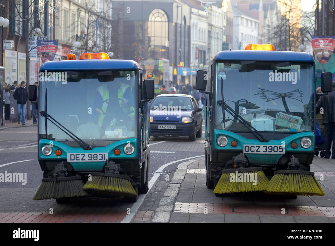 two street sweeping machines in Royal Avenue during christmas shopping