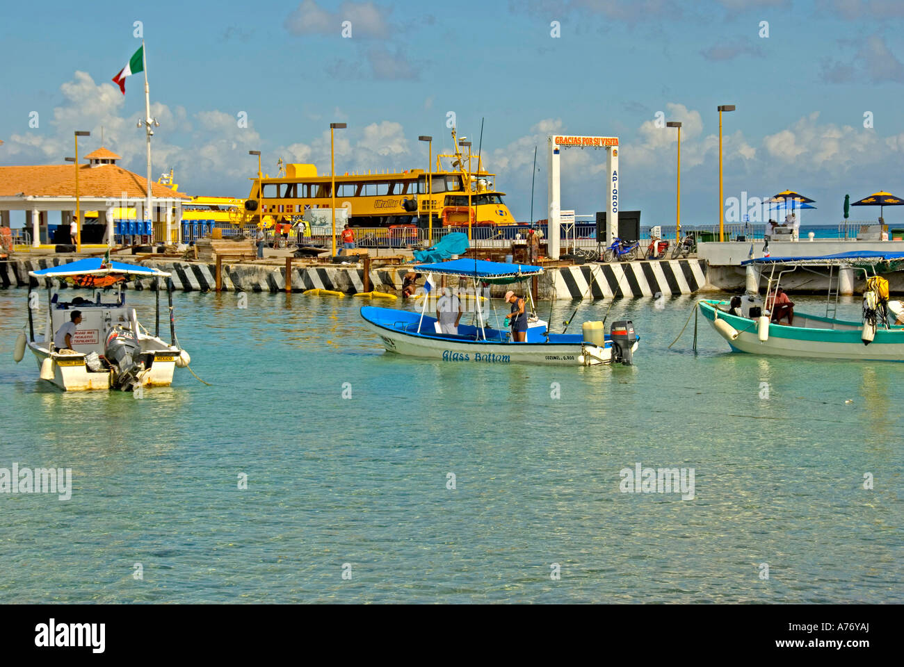 Cozumel Mexico San Miguel town malecon harbour fishing tour boats ferry  pier Stock Photo - Alamy