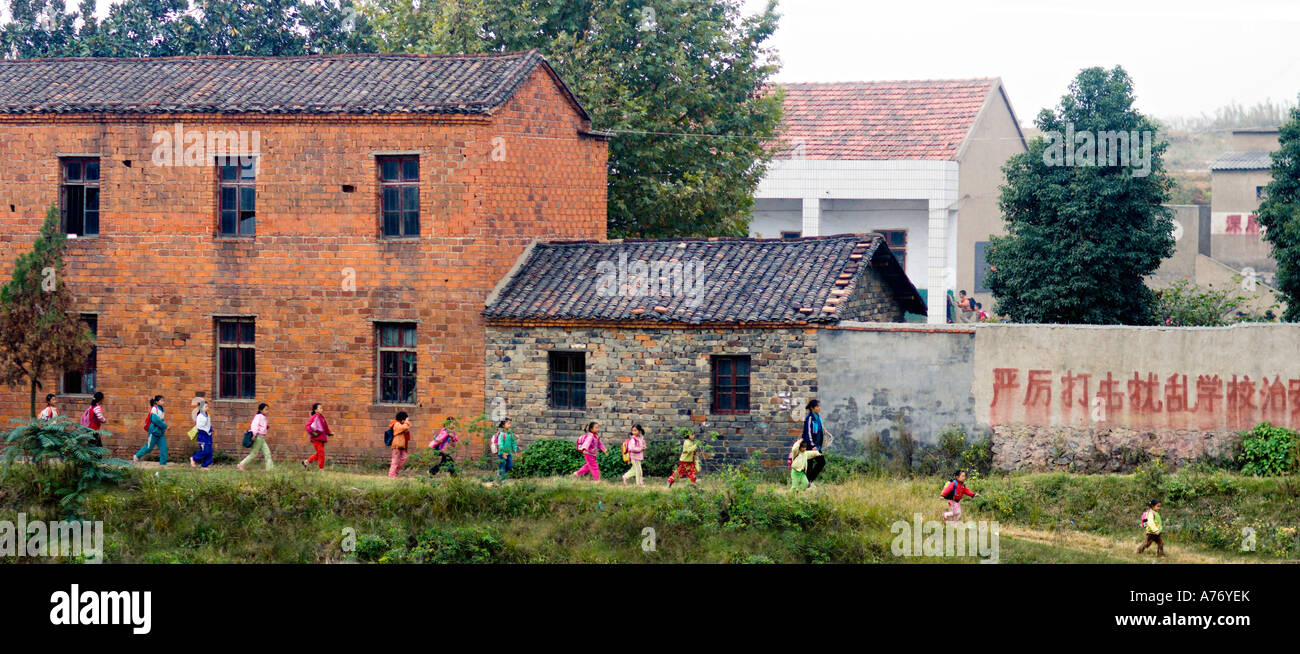 CHINA SHANGHAI Panoramic scene of young Chinese schoolgirls walking home from school in a rural community near Shanghai Stock Photo