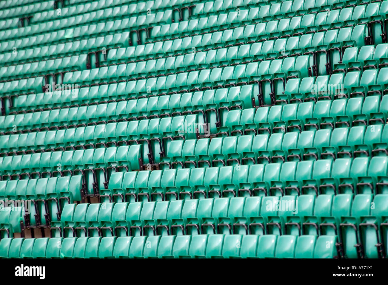 Close up of rows of green stadium seats at Twickenham Rugby ground