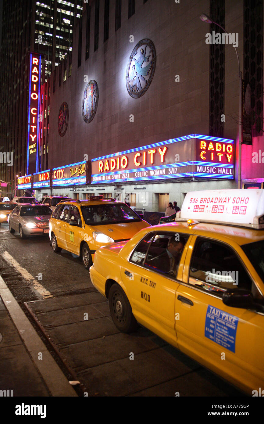 waiting yellow cabs infront of nightly radio city music hall. manhattan, new york city, usa Stock Photo