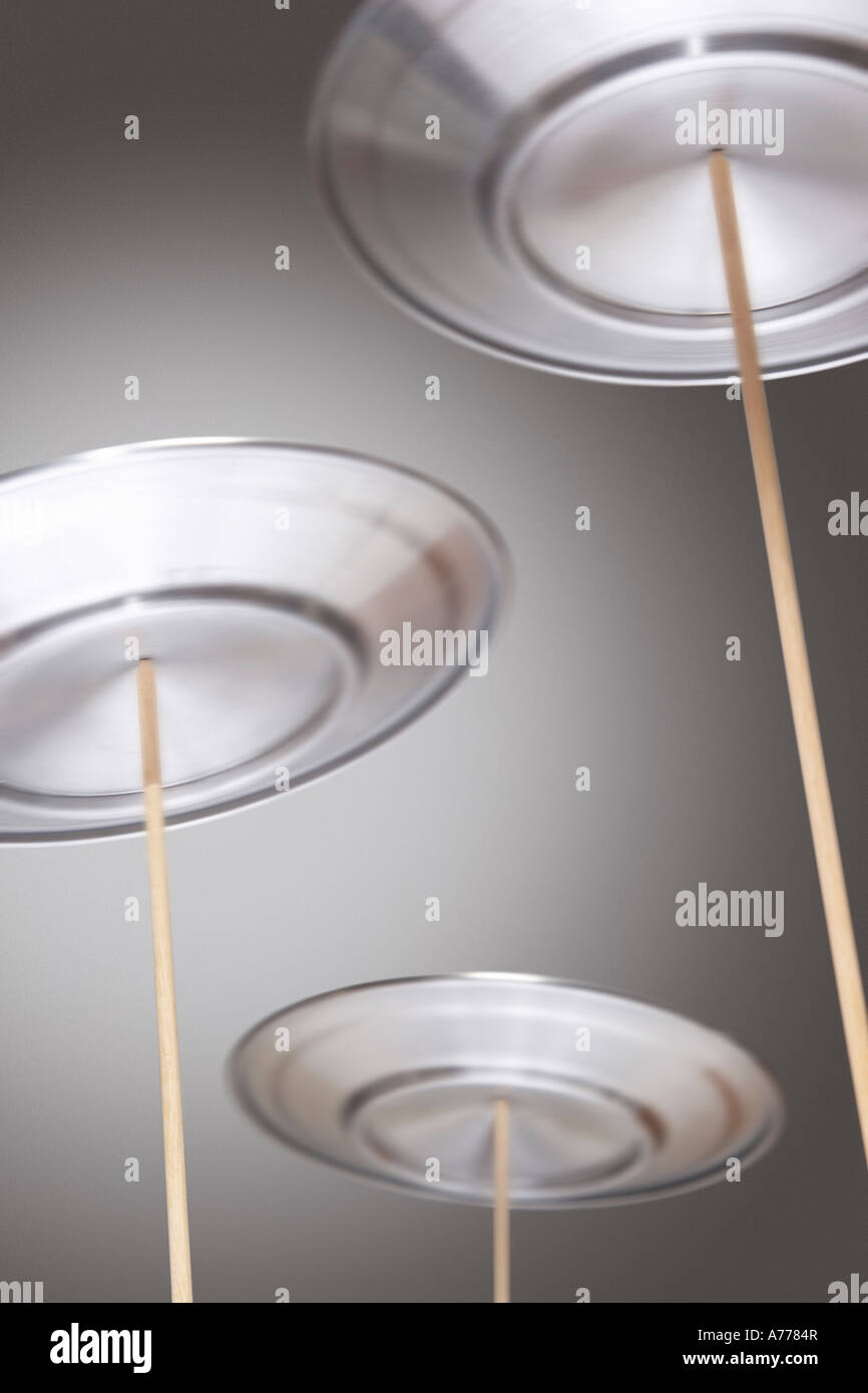 Plates Spinning on Sticks Stock Photo Alamy