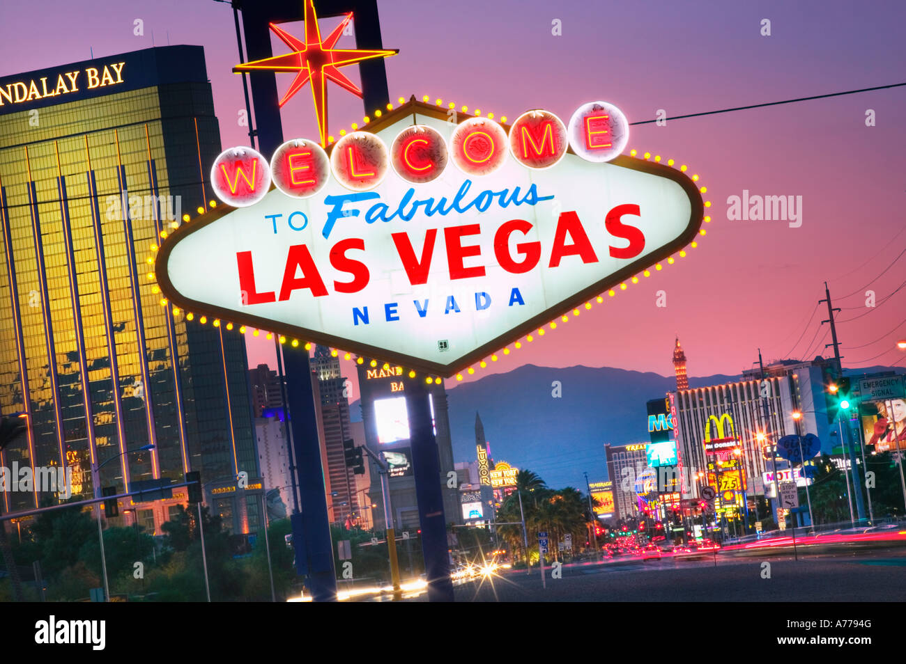 The world famous Welcome to Fabulous Las Vegas sign on Las Vegas Boulevard (The Strip) at dusk. Stock Photo