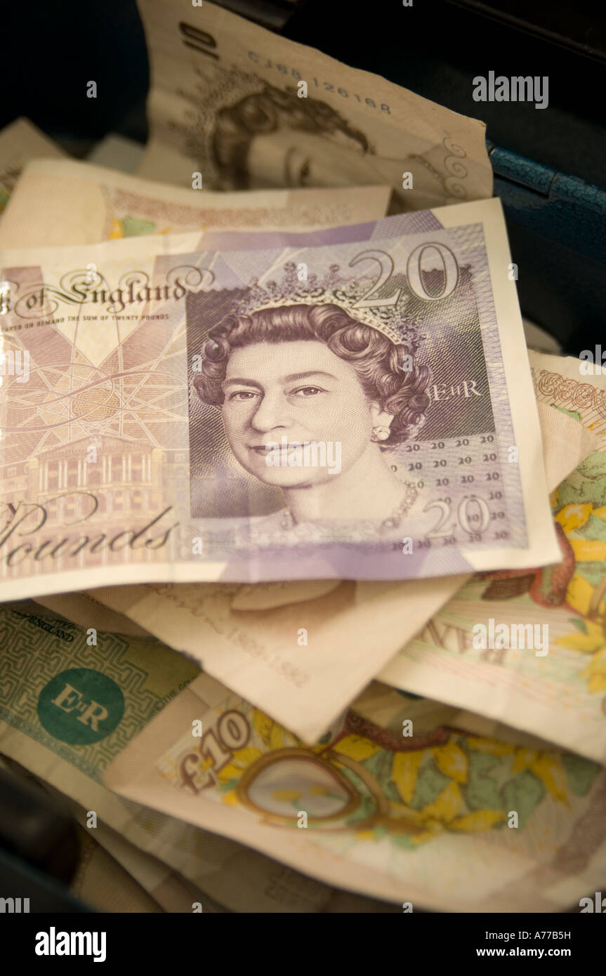 Cash box on market stall stuffed full of £20 and £10 notes UK Stock