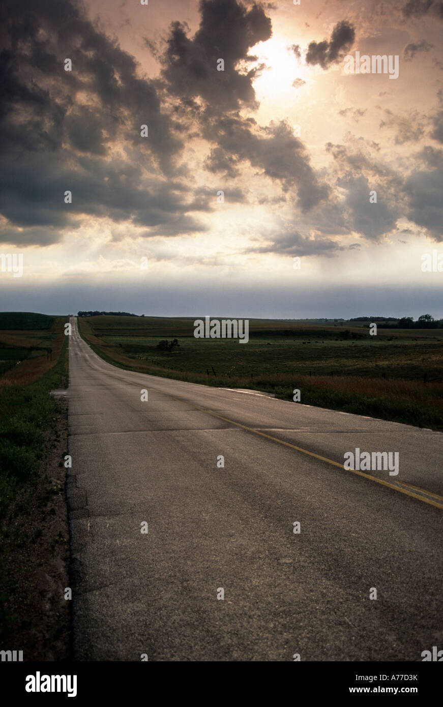 ROAD IN WESTERN MINNESOTA UNDER STORMY SKY. SUMMER. Stock Photo