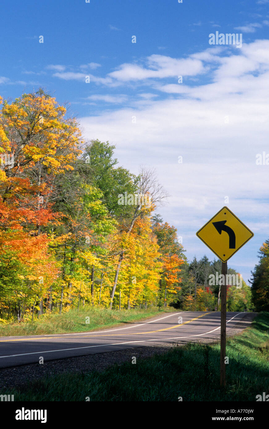 HIGHWAY AND FALL COLORS BETWEEN CABLE AND HAYWARD, NORTHERN WISCONSIN. Stock Photo