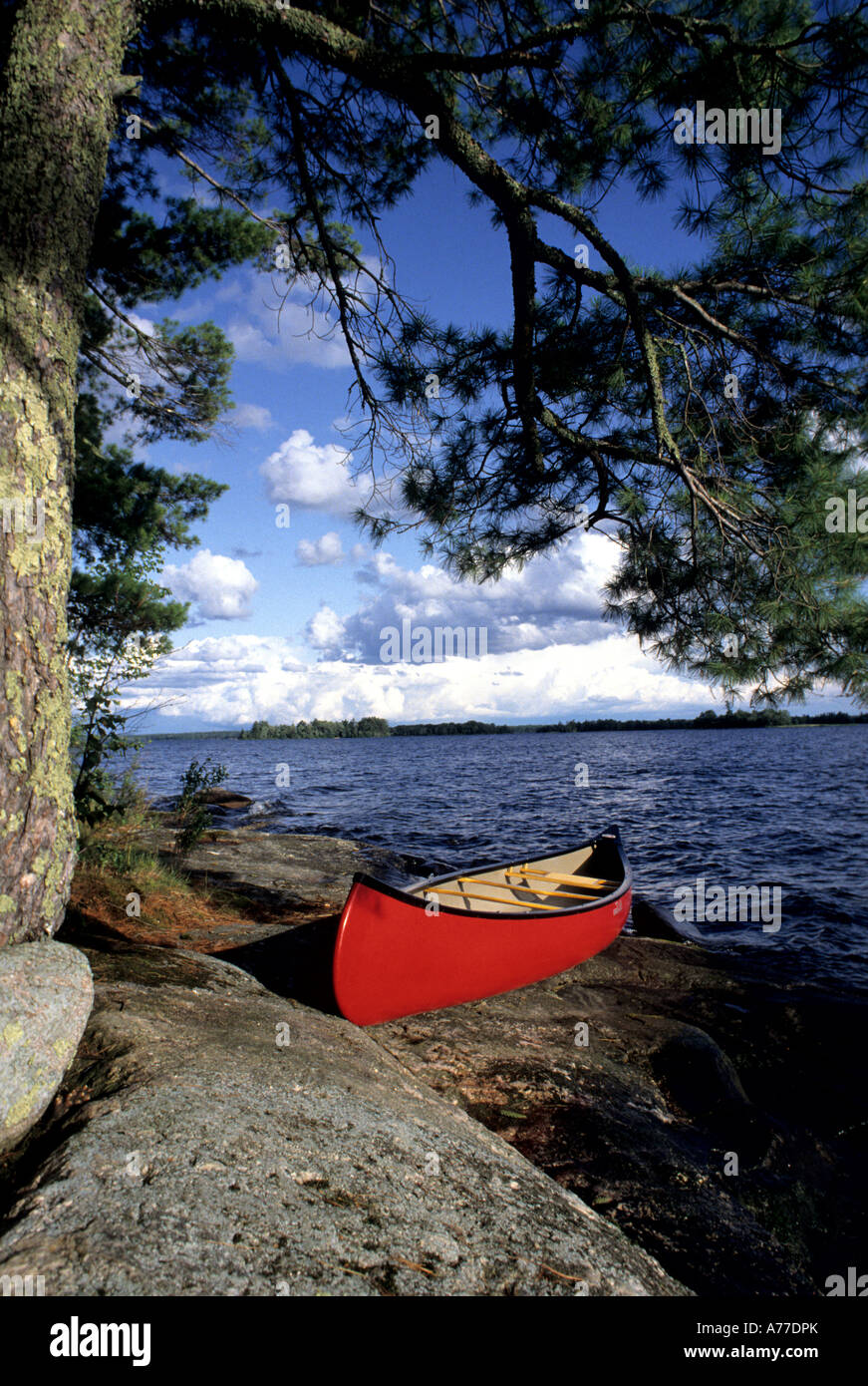 CANOE PULLED ONTO ROCKS NEAR CHIEF WOODEN FROG CAMPGROUND ON LAKE