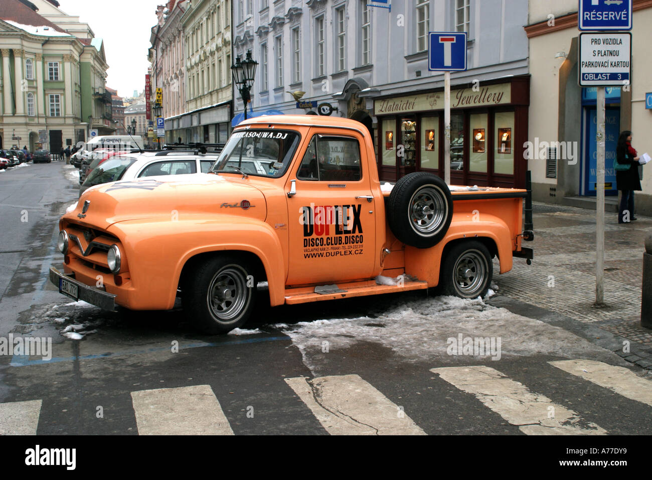 An Old Ford Pickup Truck Being Used As An Advertising