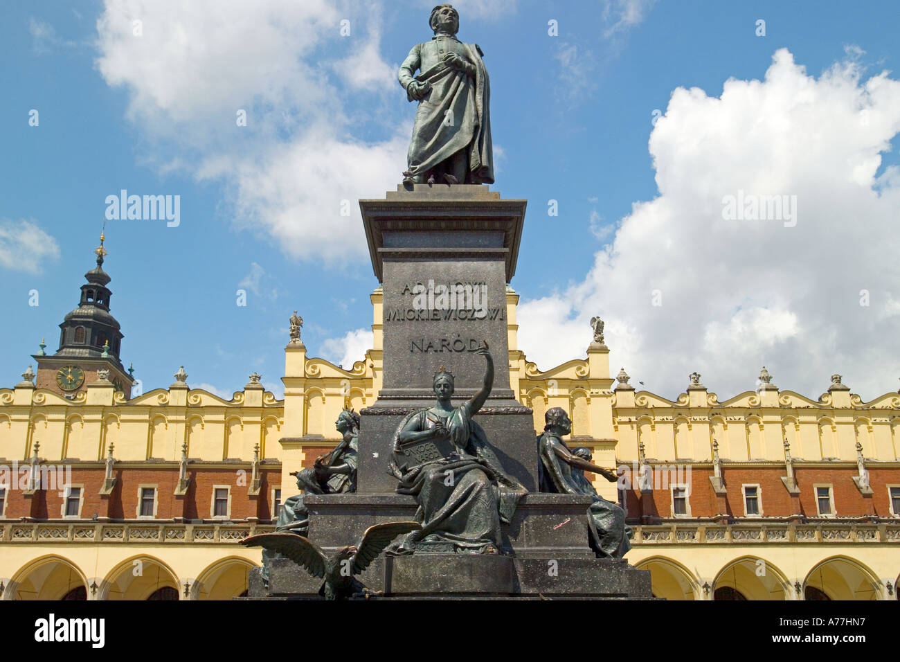 The Adam Mickiewicz Monument in the Main Market Square of Krakow in Poland with the Sukiennice Cloth Hall behind. Stock Photo