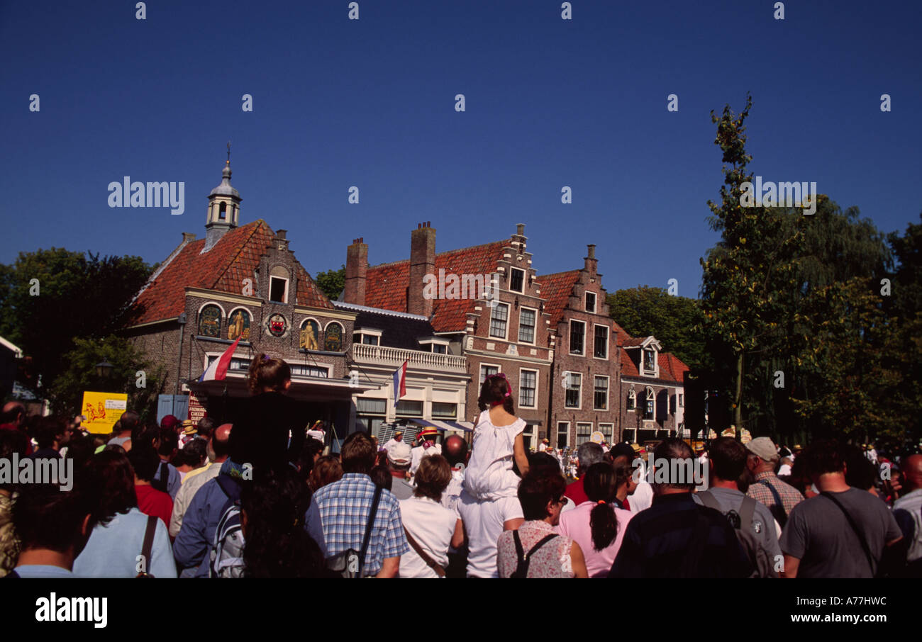 Specatators at the marketplace with historic houses Stock Photo