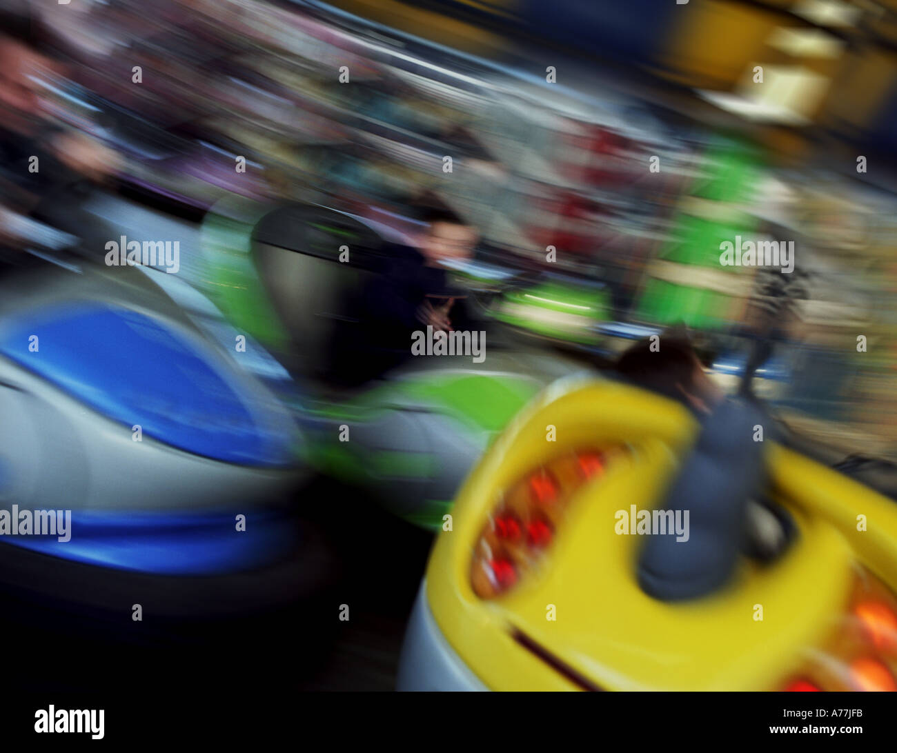 Dodgem bumper cars at speed with blur adding to the illustration of excitement and play Stock Photo