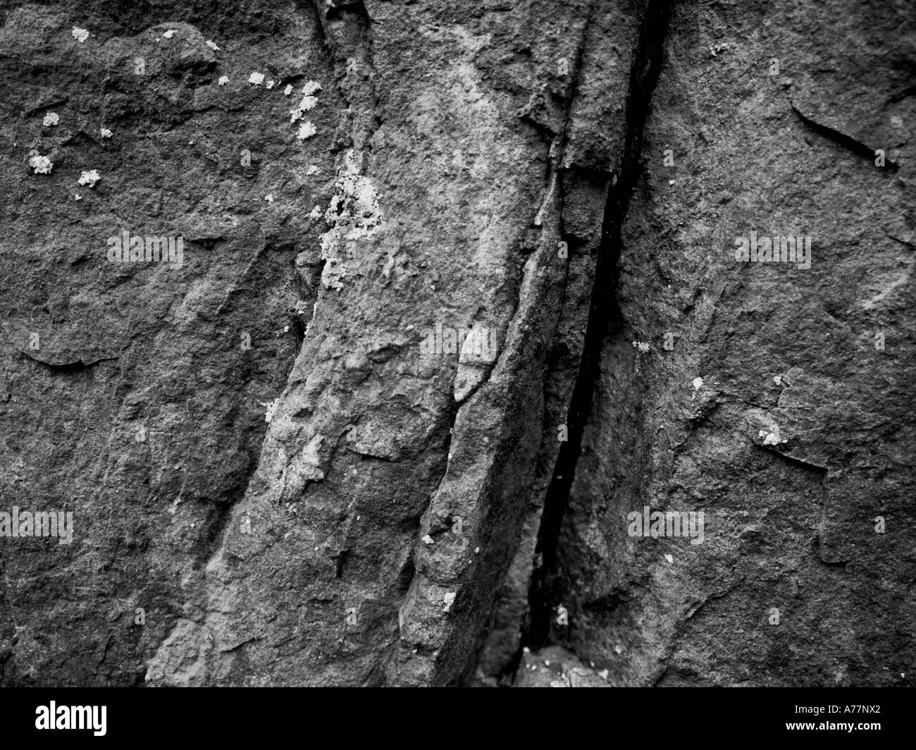 the wonderful crack and crevices of a rock face Stock Photo