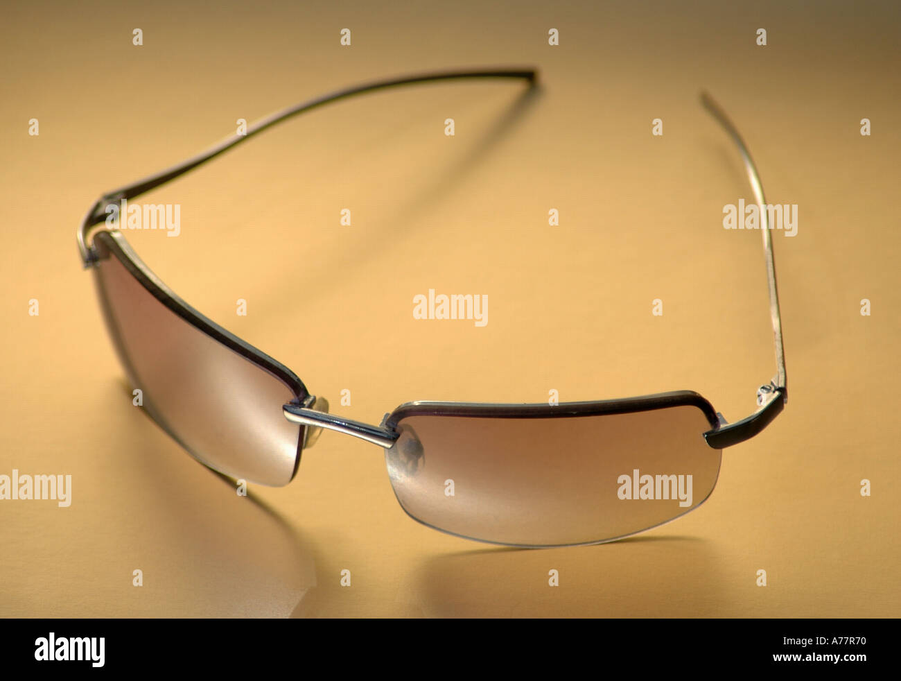 A Pair of sunglasses Shades gold Stock Photo - Alamy