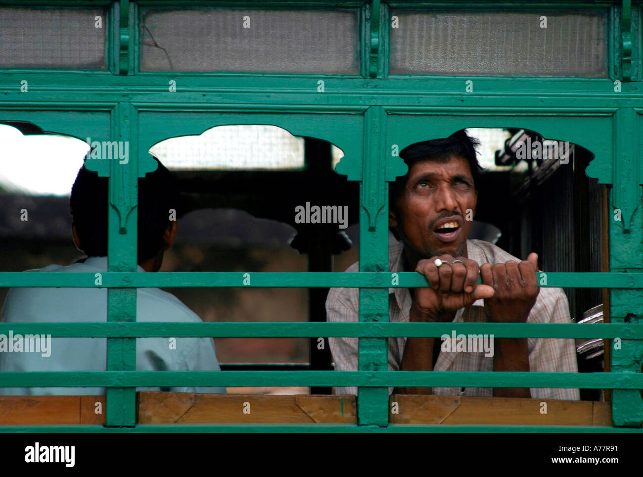 a young man looks to the sky in calcutta Stock Photo
