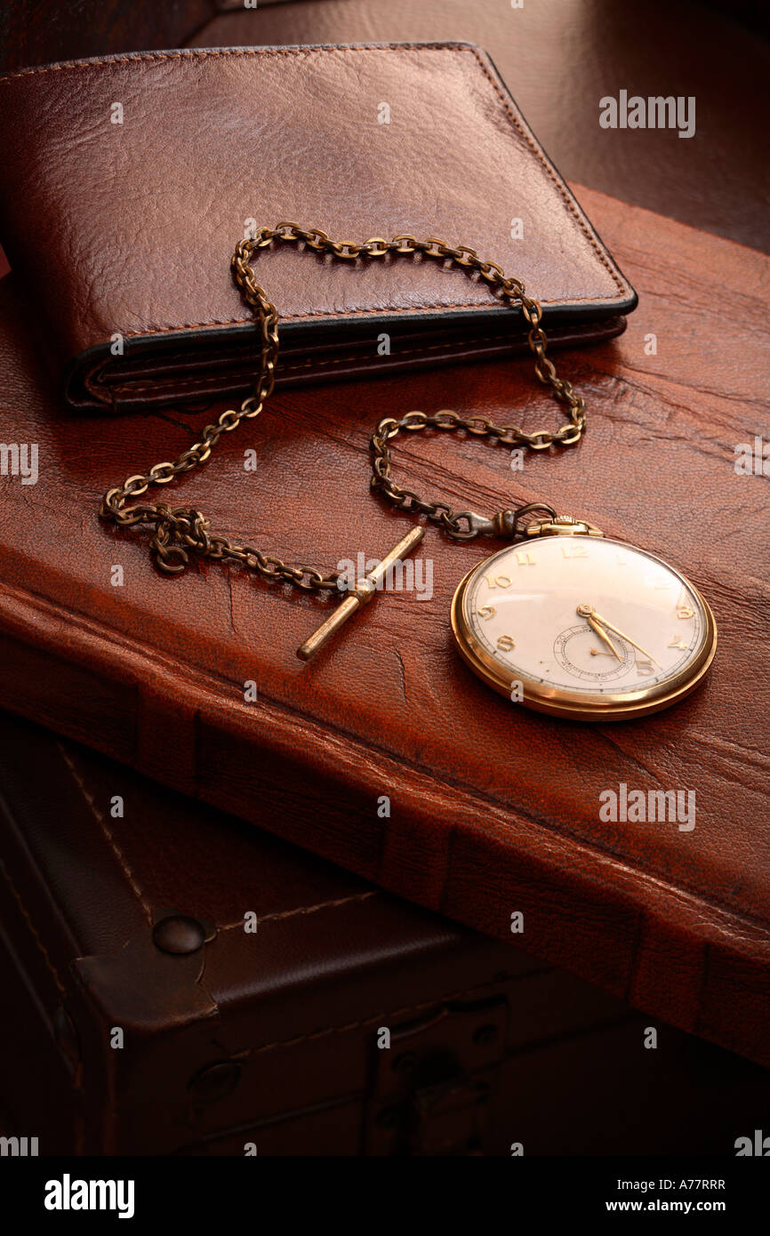 Pocket watch, wallet and leather bound book Stock Photo Alamy