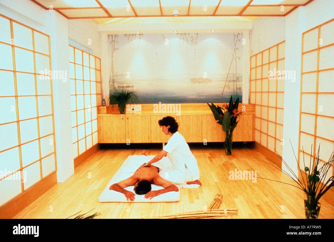 Woman massaging man Stock Photo