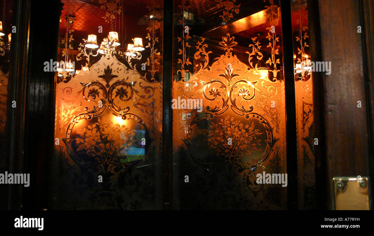 The etched glass windows of The Salisbury pub in St Martins Lane near Covent Garden in London Stock Photo