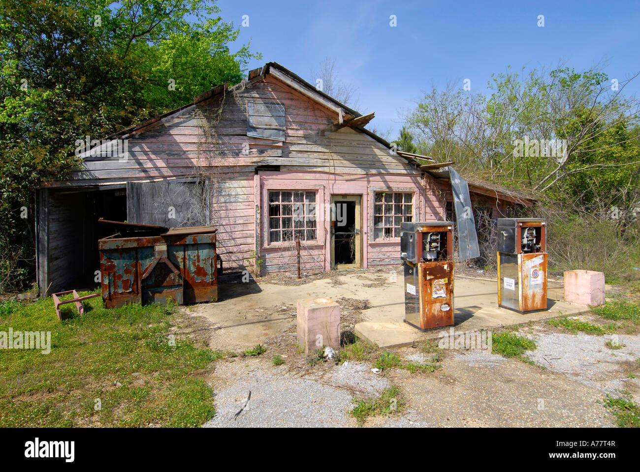 Old run down gas station with rusted pumps on the road from Selma to
