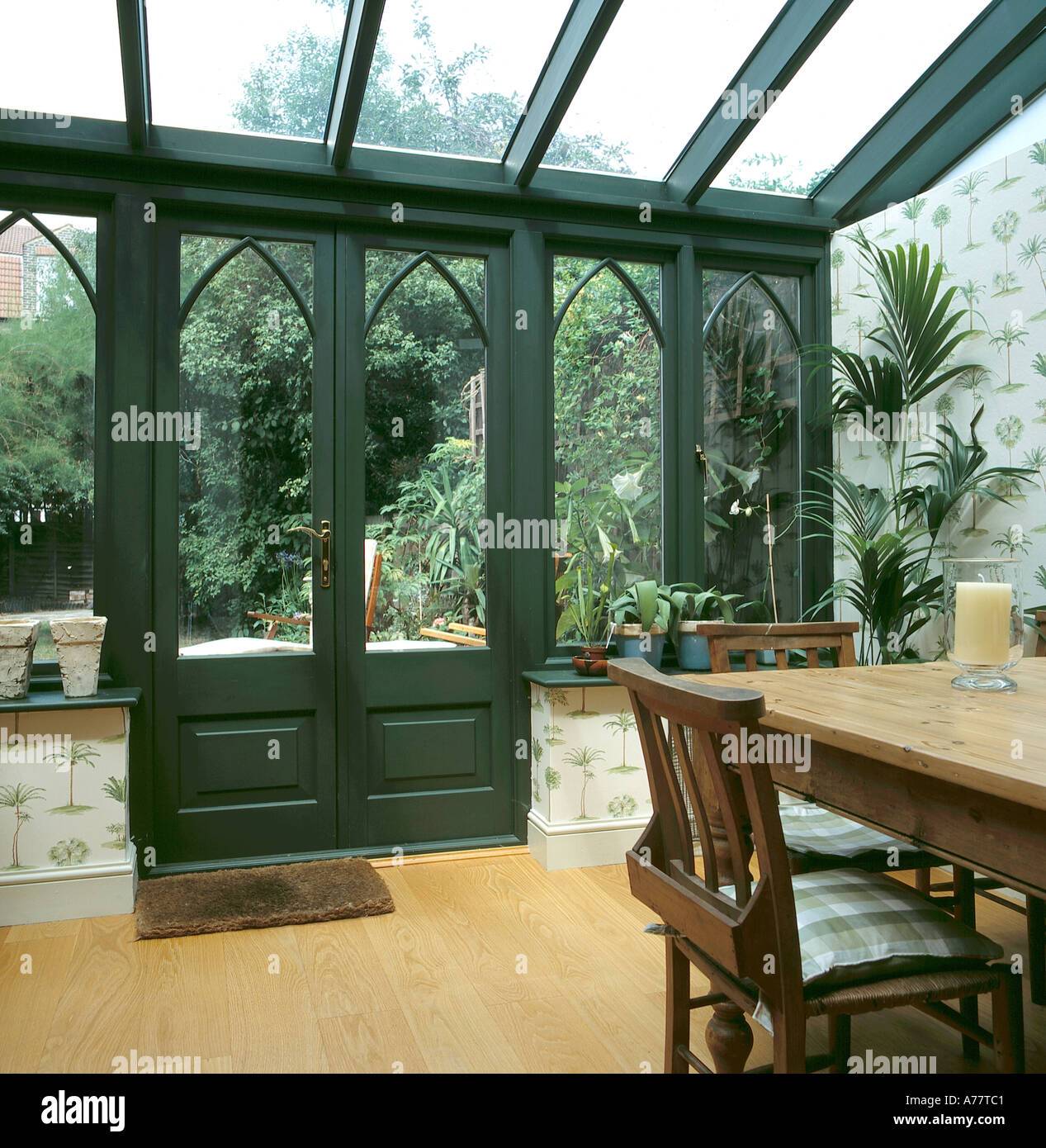 Green Painted Wooden Conservatory With Wood Strip Floor And Pine