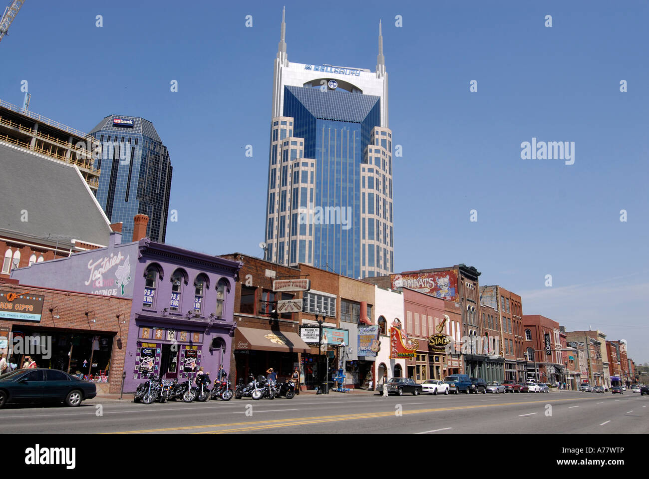 Live Music Venues along Broadway Street with Cityscape Skyline Bell