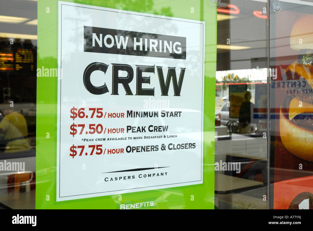 Help wanted poster posted in the window of a fast food restaurant Stock Photo