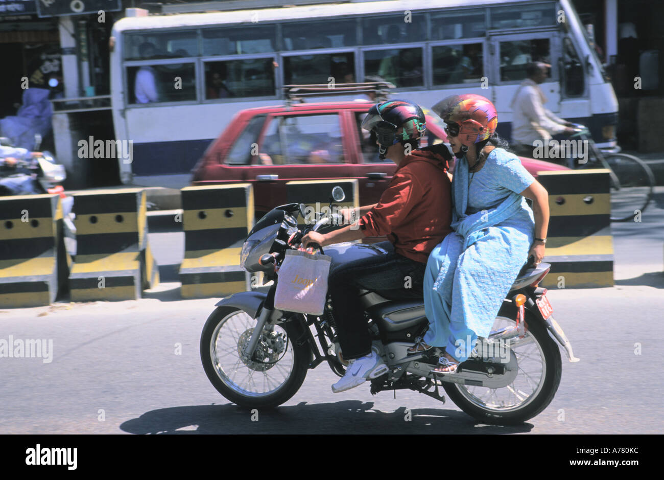 Nepali couple riding a bike in rush hour in Kathmandu city Nepal Stock