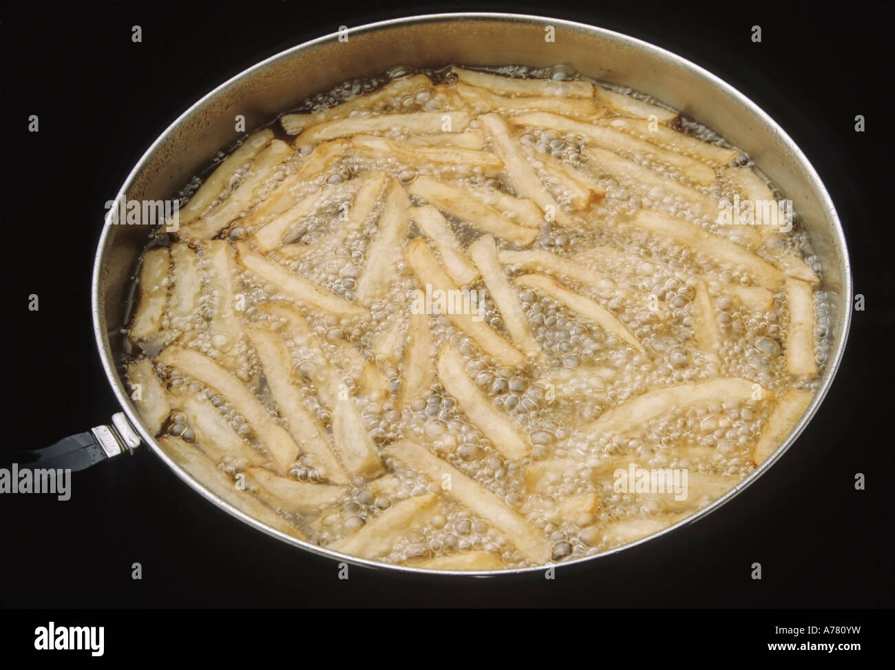French Fries in Cooking Oil Stock Photo Alamy