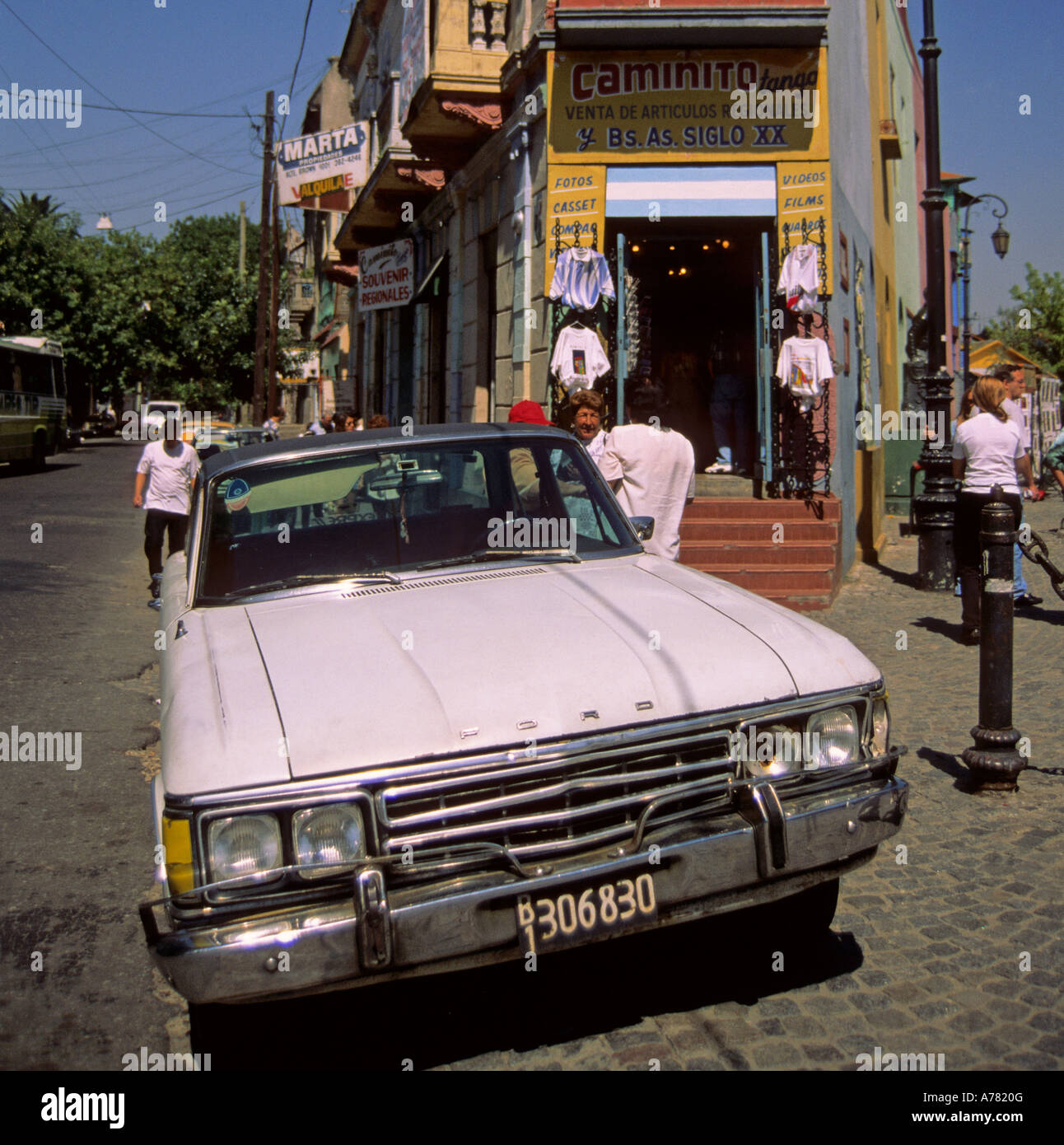 a vintage Ford car parked beyond a souvenir shop in the touristic area of El Caminito La Boca quarter Buenos Aires Argentina Stock Photo