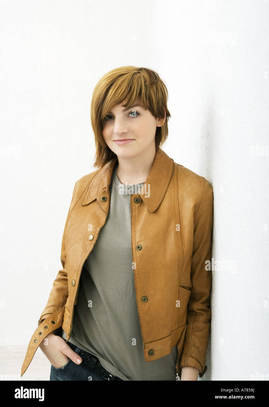 Young woman standing with hand in pocket, portrait Stock Photo - Alamy