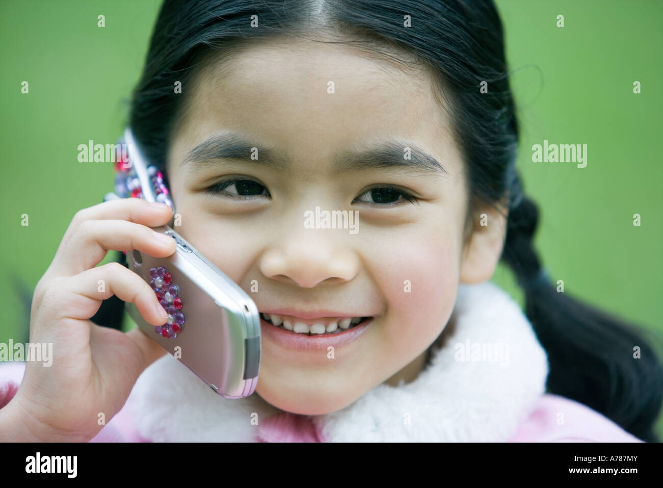 Girl using cell phone, close-up Stock Photo