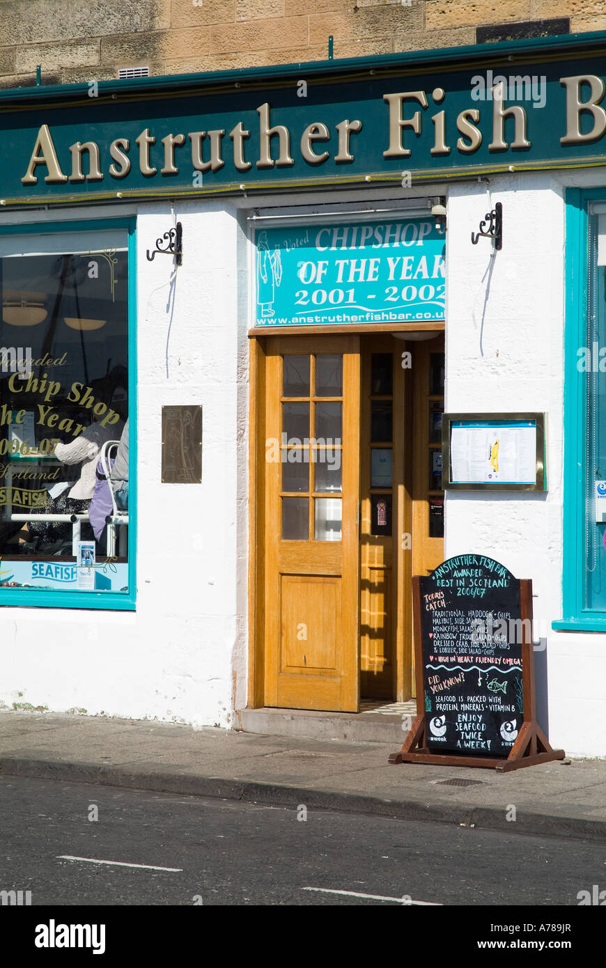 dh Scottish Fish Bar ANSTRUTHER EAST NEUK FIFE SCOTLAND Famous Fish Chip shop entrance front door menu board seafood restaurant UK takeaway chips Stock Photo