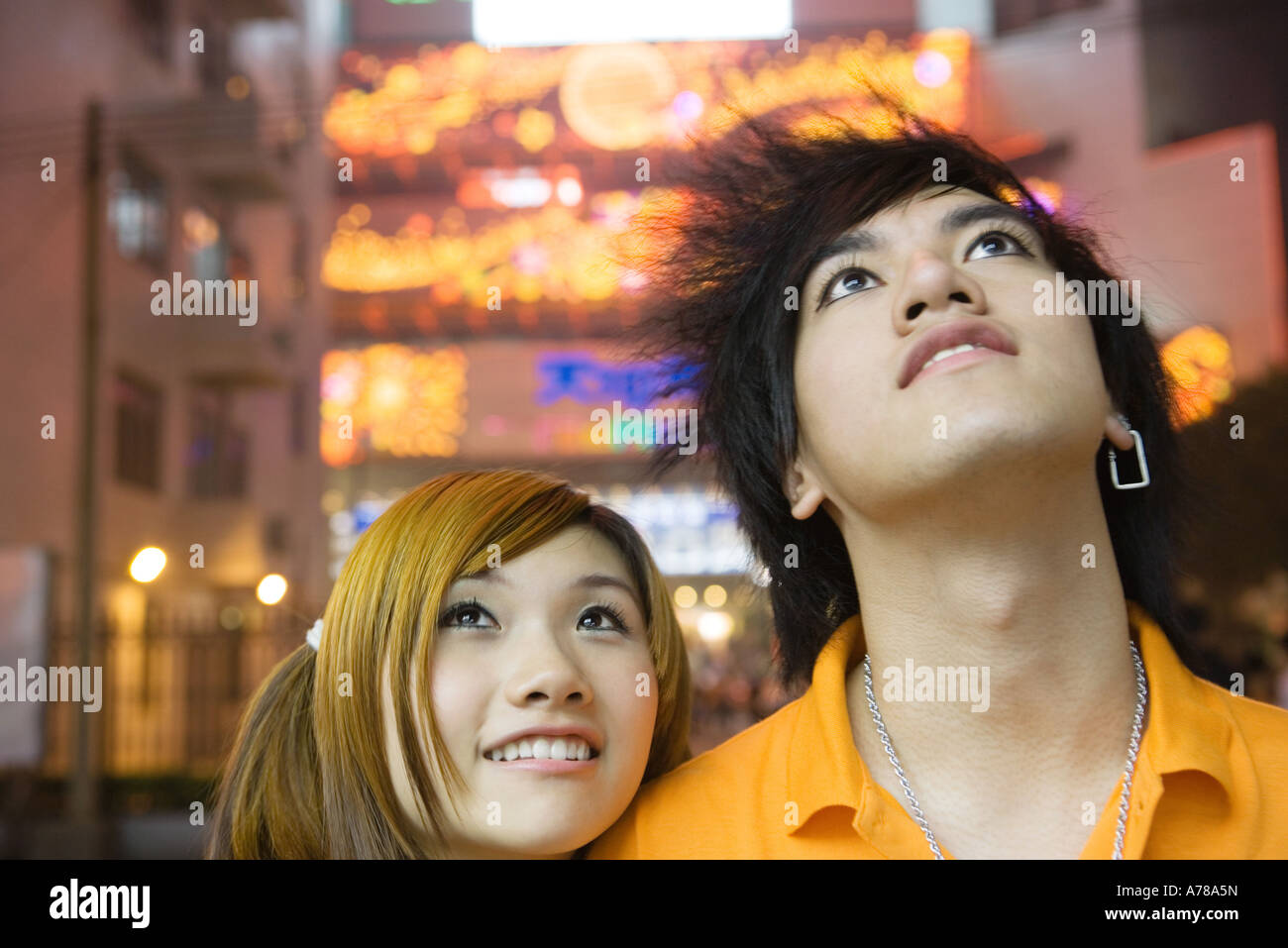 Young couple, looking up, portrait Stock Photo