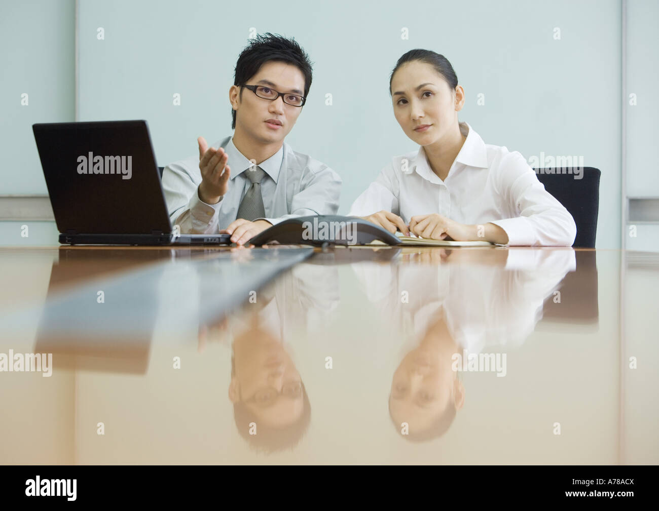 Business executives working in conference room Stock Photo - Alamy