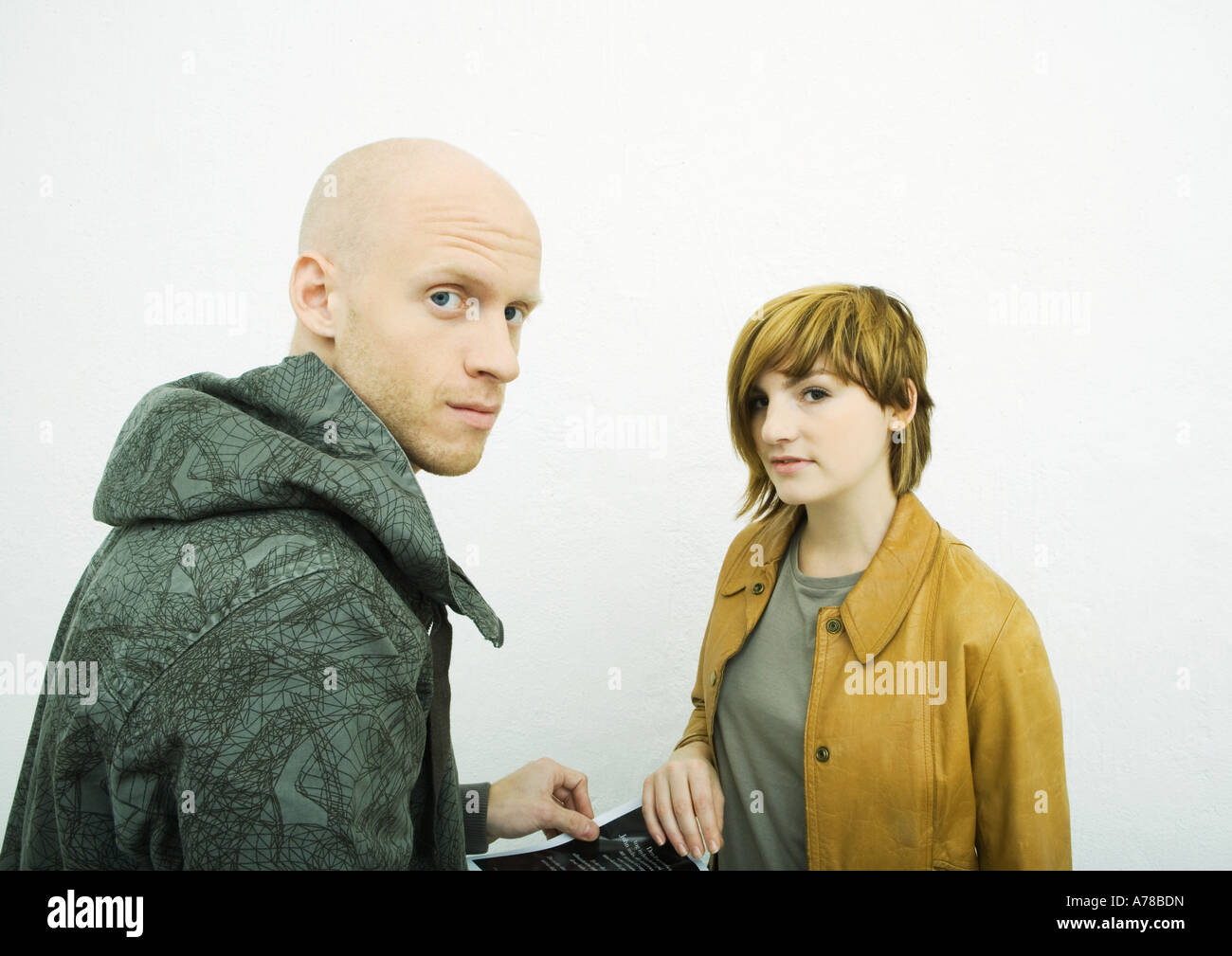Two young adults, looking at camera Stock Photo