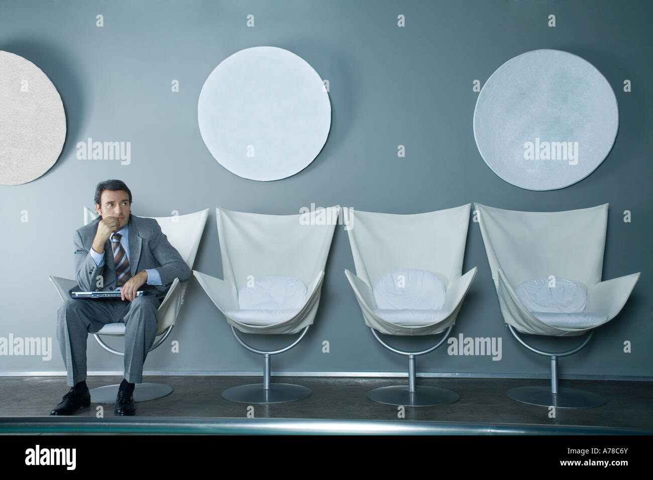 Sitting waiting room hands on lap hi-res stock photography and images ...