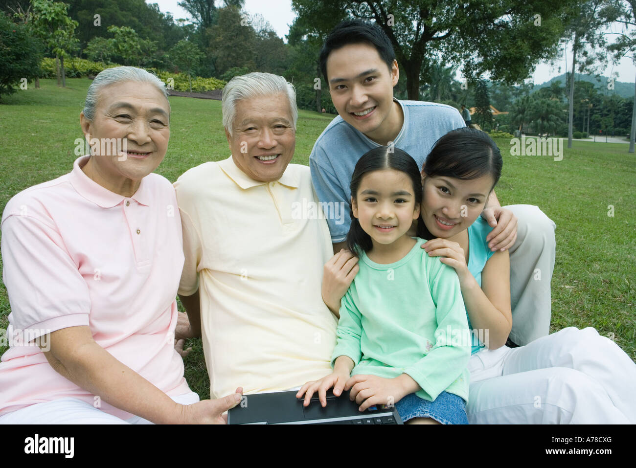 Three generation family, smiling at camera Stock Photo
