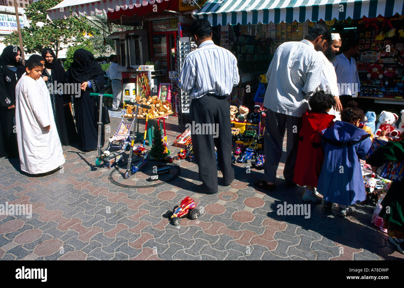 Abu Dhabi UAE Families Shopping In The Souk For Toys Stock Photo Alamy