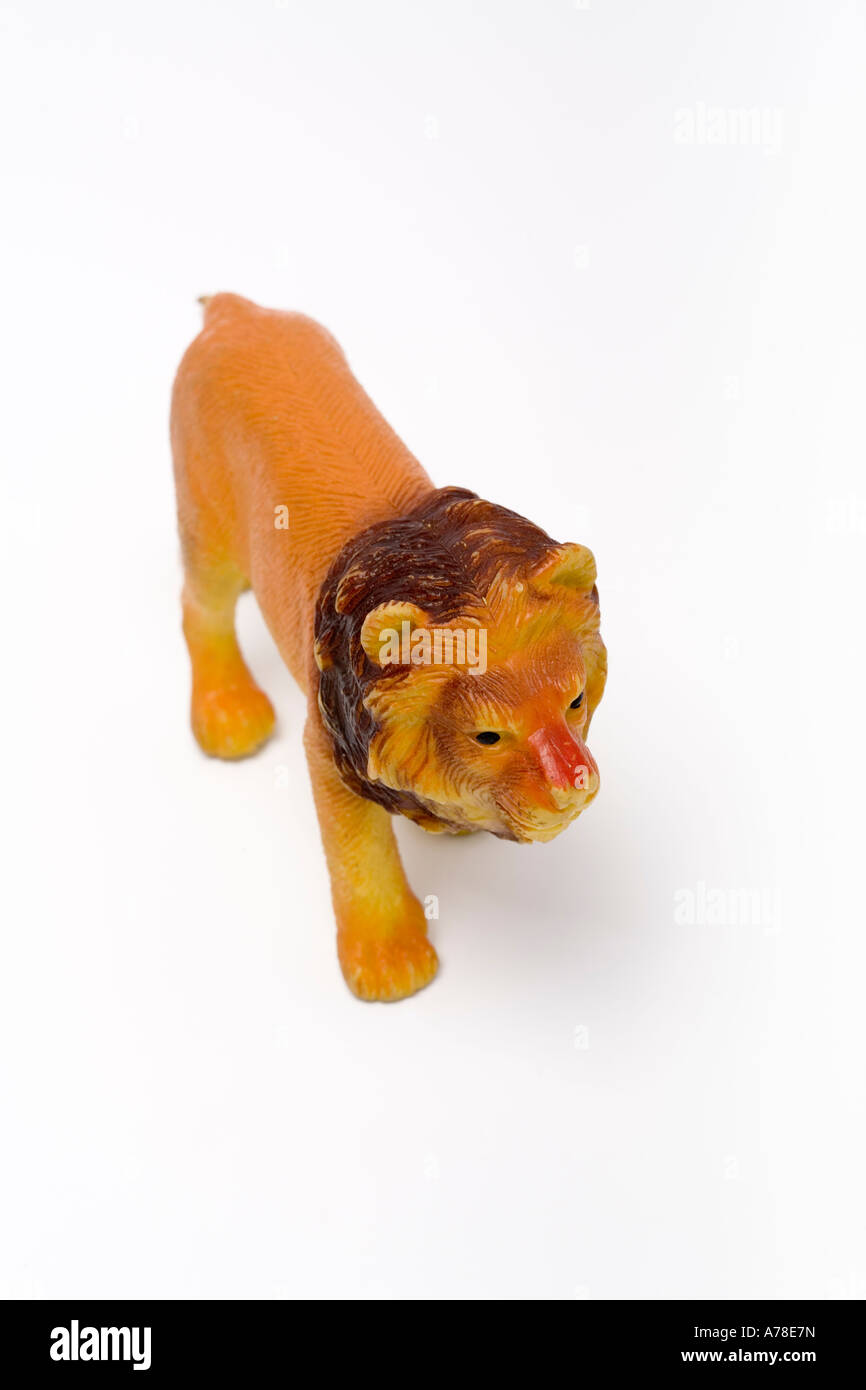 One plastic lion toy walking on white background Stock Photo Alamy