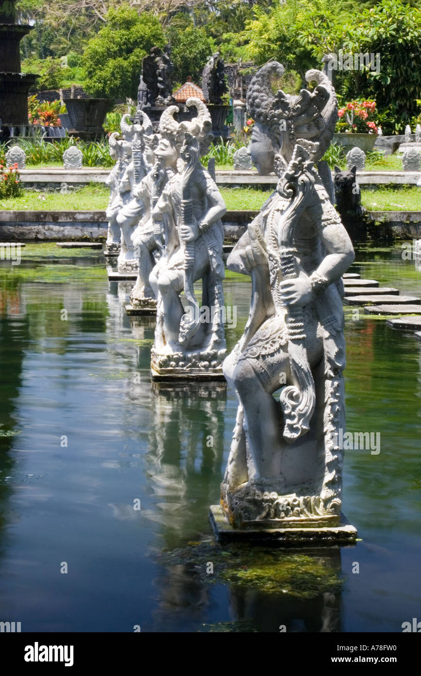Statues in ornamental pool at water palace of Taman Tirta Gangga Bali