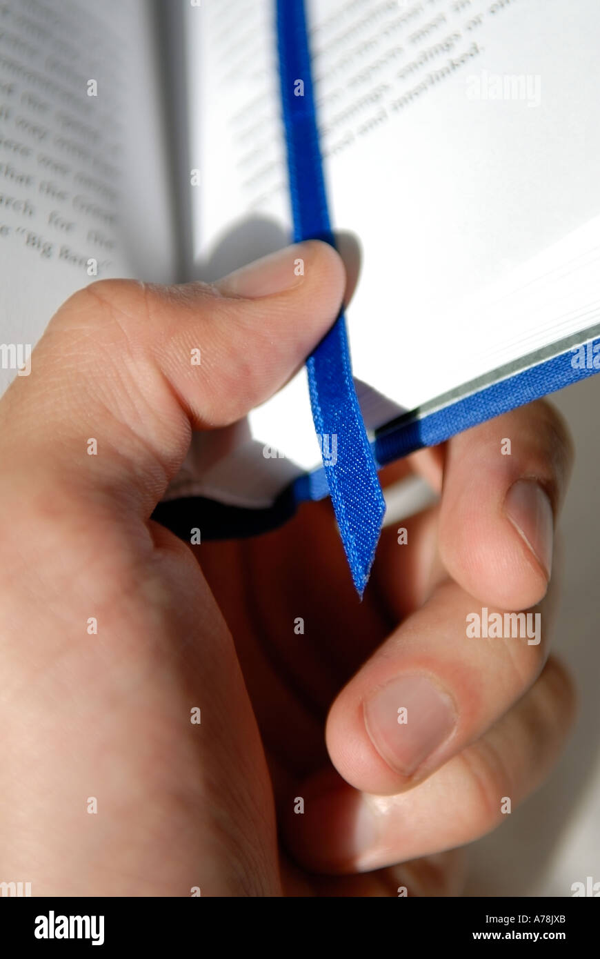 Hand Holding Book Stock Photo