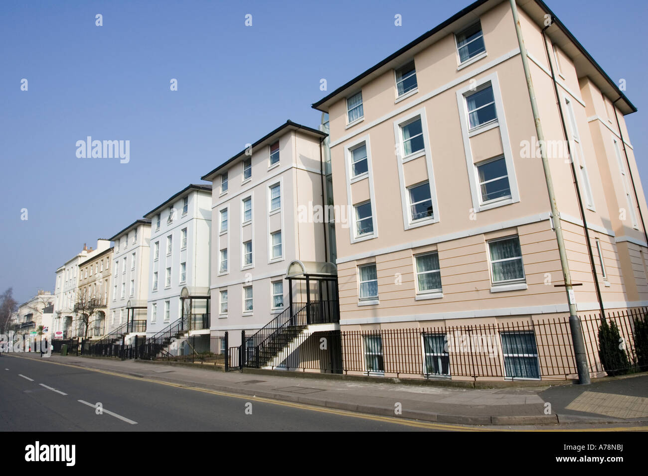 Terrace of Victorian style town house flats with connecting glass
