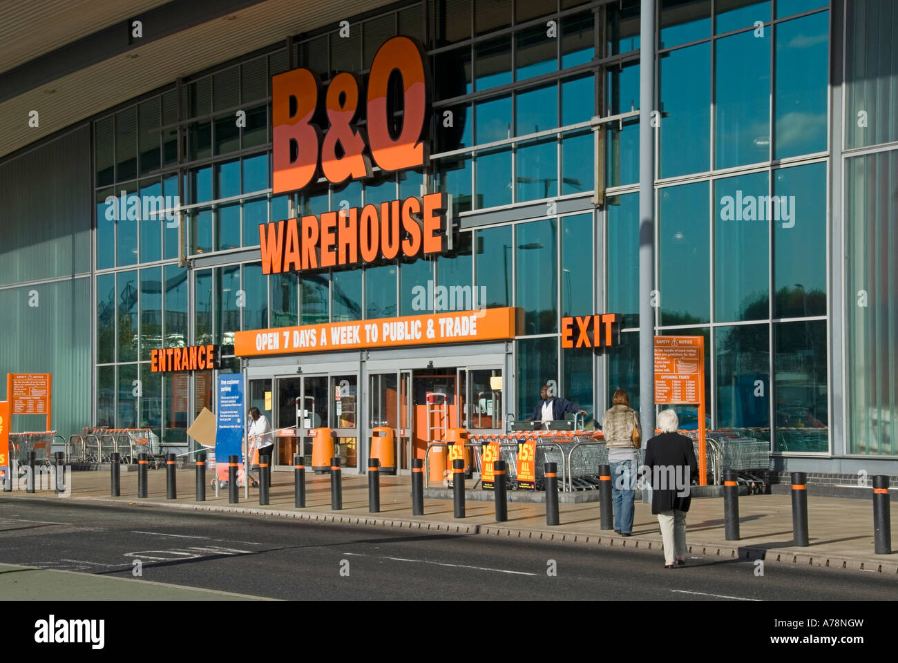 Customers walking towards entrance to large B&Q do it yourself