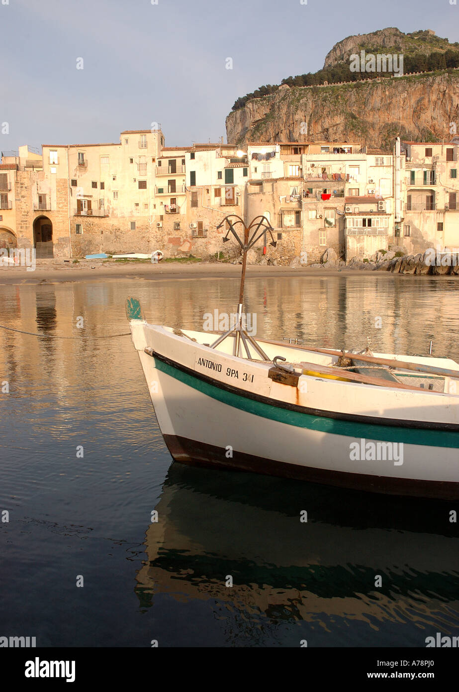 Fishing boats in Cefalu's old fishing harbour in Northern Siciliy Stock ...