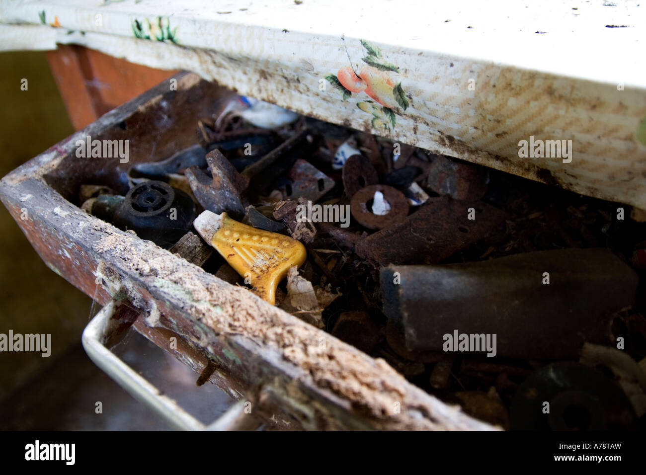 Rotting drawer of old tools, nuts, bolts and various rusted stuff Stock Photo