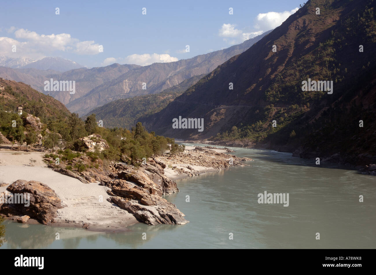 Women and children wash clothes in the river Indus, Allai valley ...