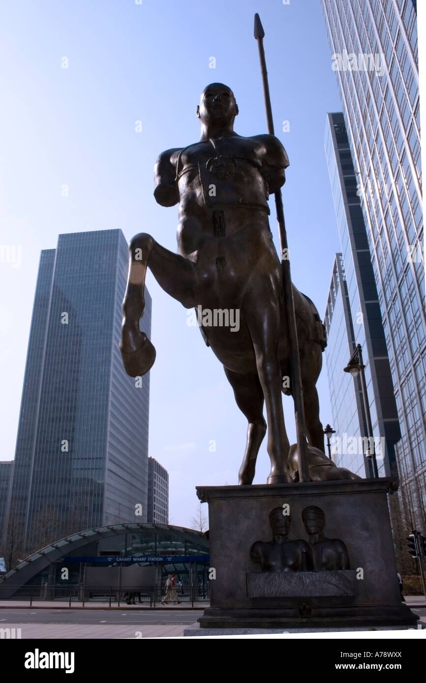 CENTAURO, a bronze sculpture by Igor Mitoraj in Upper Bank Street, shown here flanked by  offices and Canary Wharf station. Stock Photo