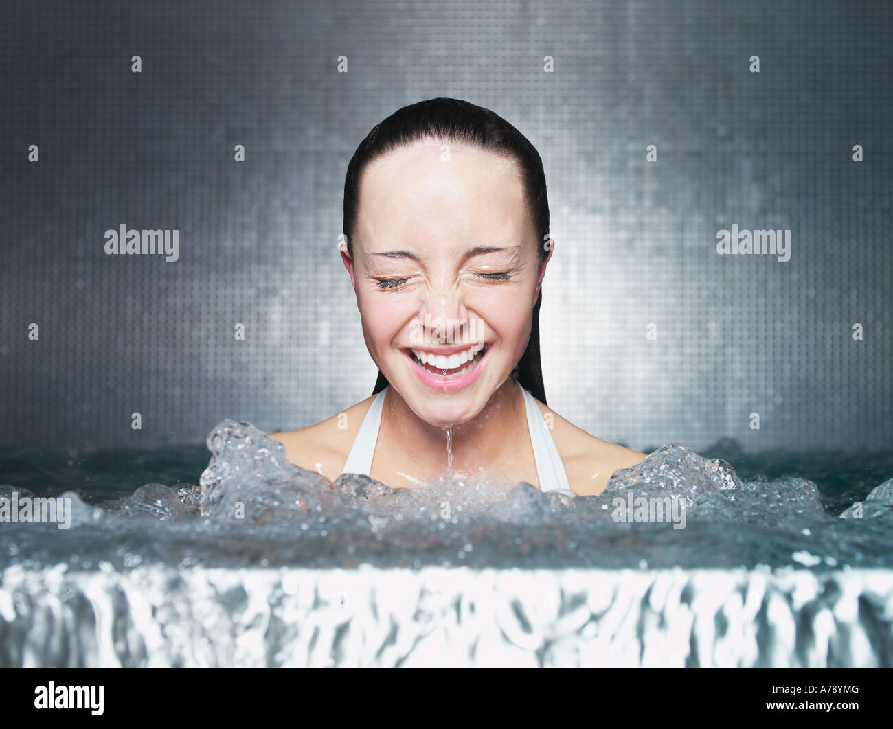 Woman immersing in jacuzzi Stock Photo Alamy